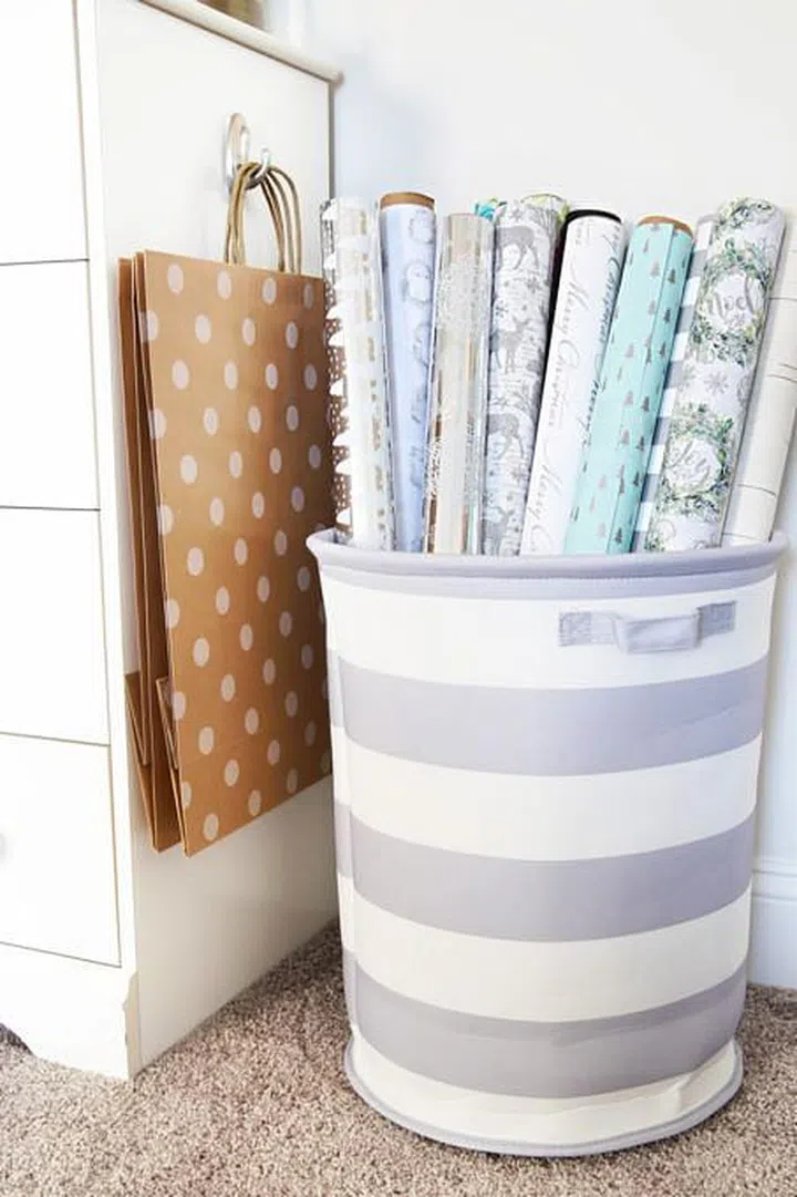 Store wrapping paper upright in a laundry basket