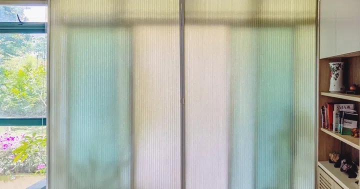 Installed across the window, honeycomb blinds diffuse daylight while creating a layer of trapped air that slows heat entering the room.