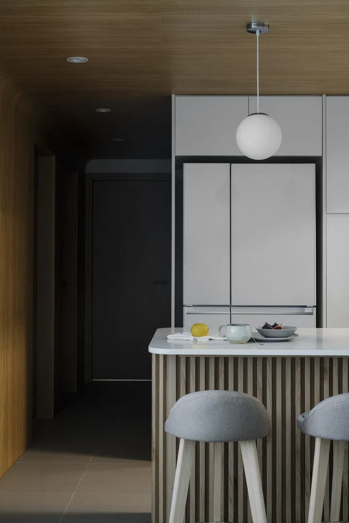 Close up of the kitchen island dining table in a young lawyer couple's 3-bedroom condominium in Bishan.