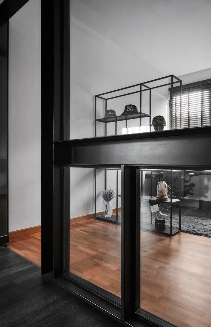 Glass walls define the study while allowing light to filter into the adjoining corridor. 