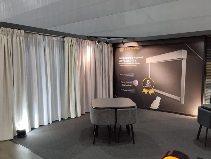Secret Furnishing curtains at an expo. Image from Secret Furnishing Facebook