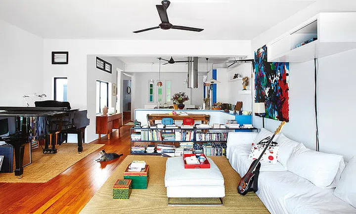 The black piano is a welcomed sight, in this colourful and vibrant home. Design by WY-TO