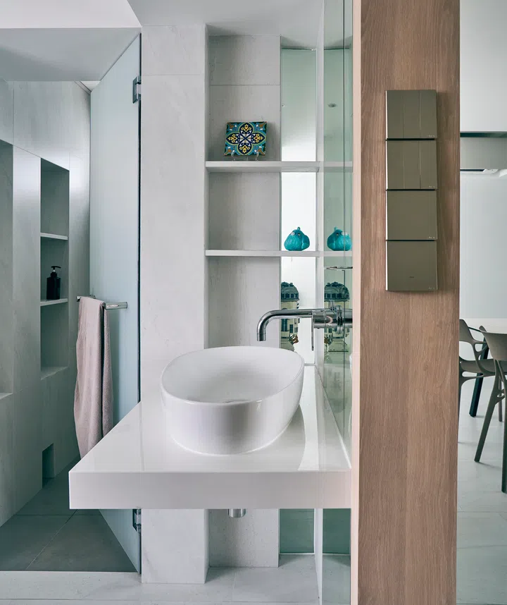 The interior designers chose to place the vanity outside the WC and shower. 