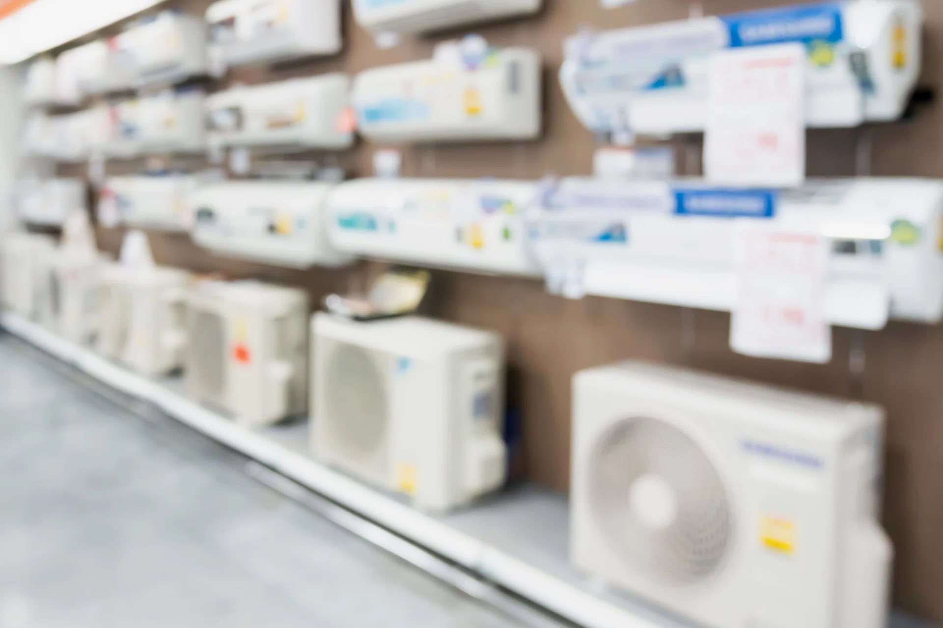Blur electronic department store with air conditioner background.