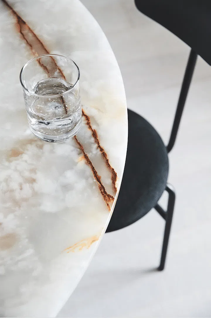 The homeowners, Evon Chng and Joseph Ho, designed all of their furniture at home from scratch, such as this Jade dining table.