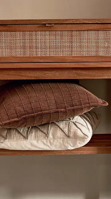 Cushions; Premium solid raw teak wood and rattan console table, all from Mountain Living.