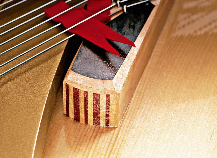 Patented in 1880 by Theodore Steinway, vertically laminated bridges are made from multiple layers of wood.
