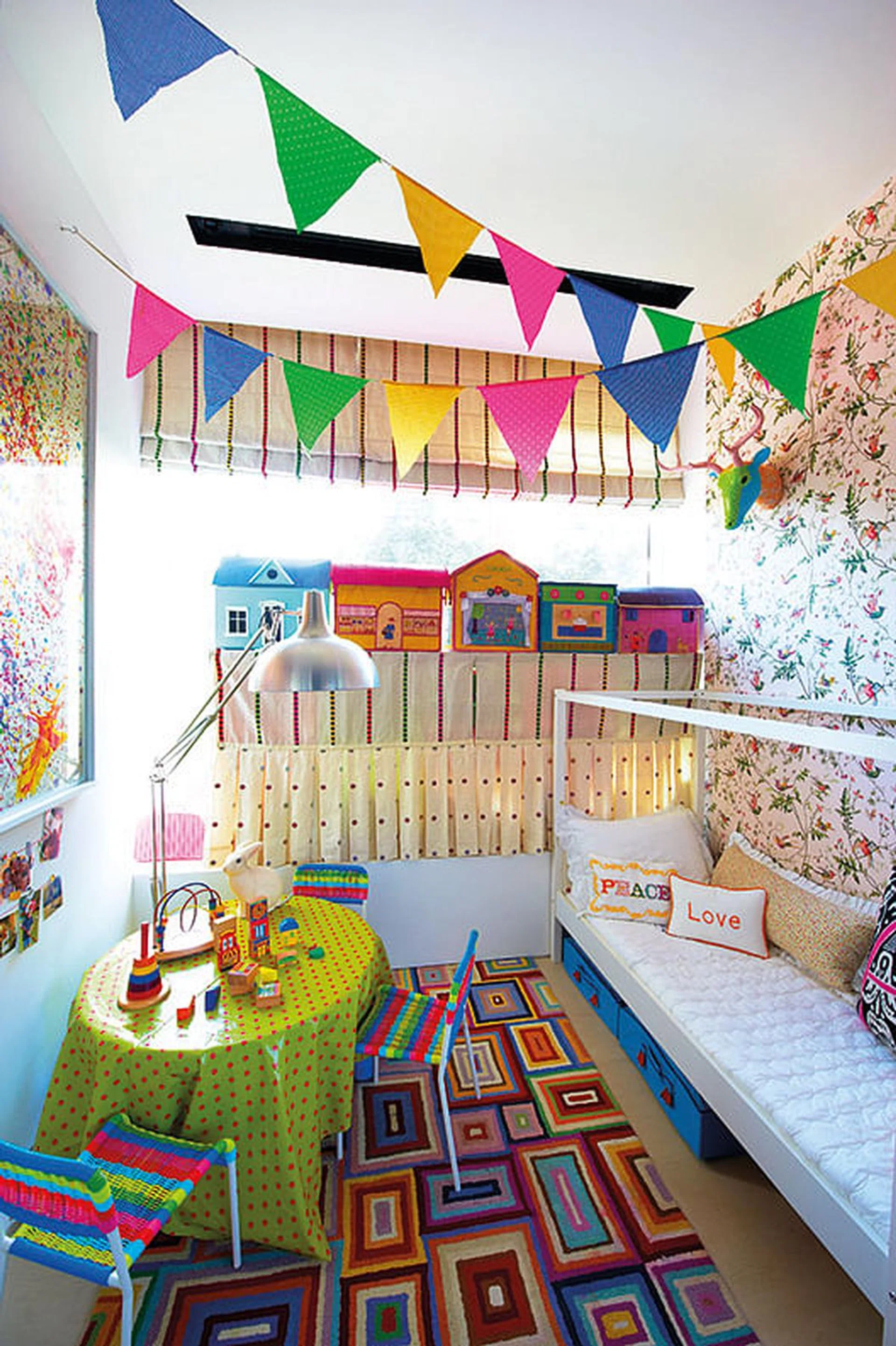 Storage space for children's toys and books was a key concern. Open shelves hidden by fabric panels sit on the bay window in the daughter's room.