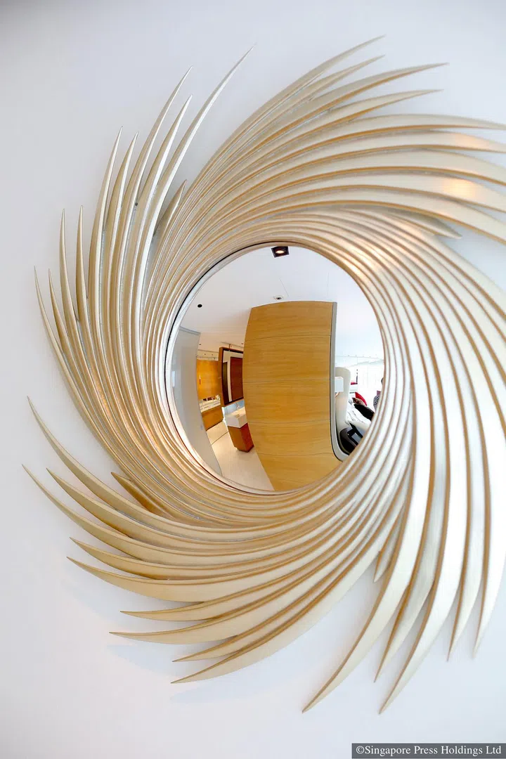 A mirror inspired by celebrity milliner Philip Treacy’s creation for the Duchess of Cornwall in 2005. It is hung on the wall of British luxury furniture designer Christopher Guy Harrison's three-bedroom apartment in High Street Centre.