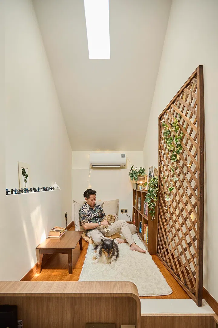 The hidden attic space is left intentionally simple—a quiet corner for reading and retreat.