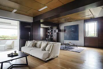 Warm woods juxtapose with cool metal and concrete in this luxe-meets-industrial-themed home.
