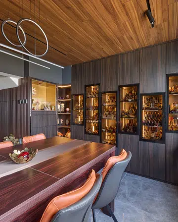 Glass wall display cabinet houses the homeowner's crystal collection in a HDB Executive Maisonette in Pasir Ris.