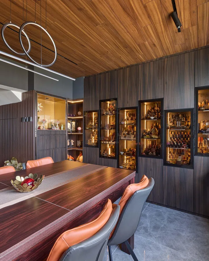 Glass wall display cabinet houses the homeowner’s crystal collection in a HDB Executive Maisonette in Pasir Ris.