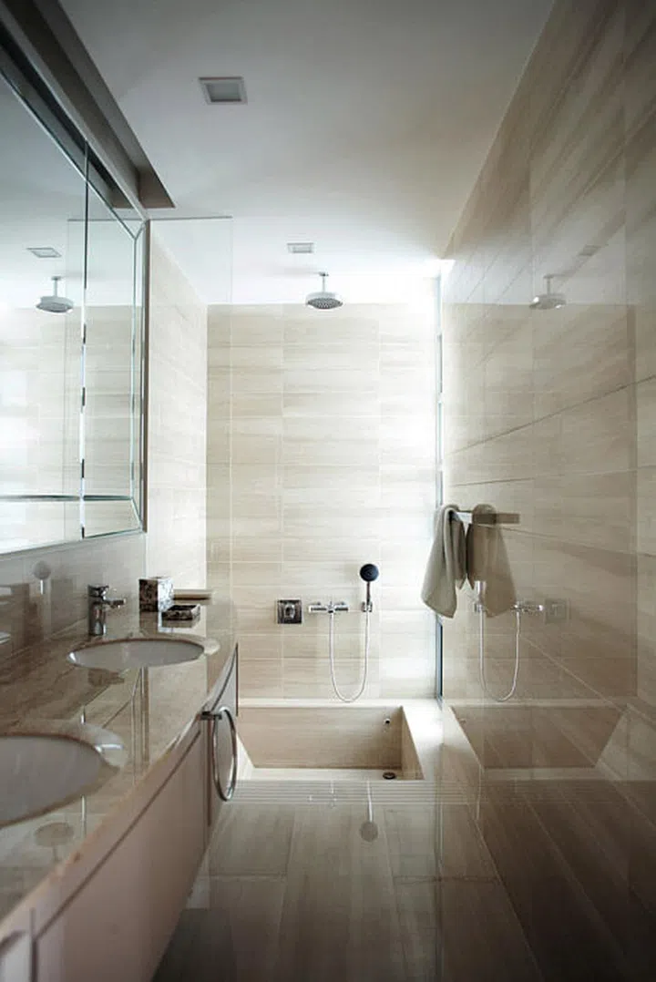 Luxury was the keyword for the decor of this city destination, from its marble-clad bath to its sleek accents. The rainshower and sunken bath are standard-issue features of the luxury development.