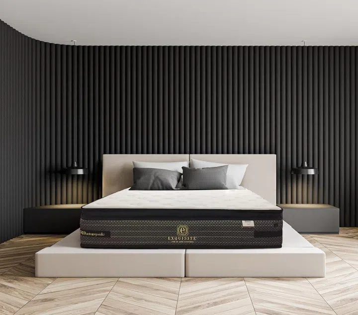 Interior of stylish minimalistic master bedroom with grey and white walls, wooden floor, comfortable king size bed with two bedside tables and white armchair. 3d rendering