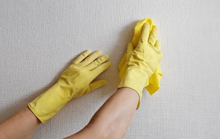 cleaning a wall before painting it