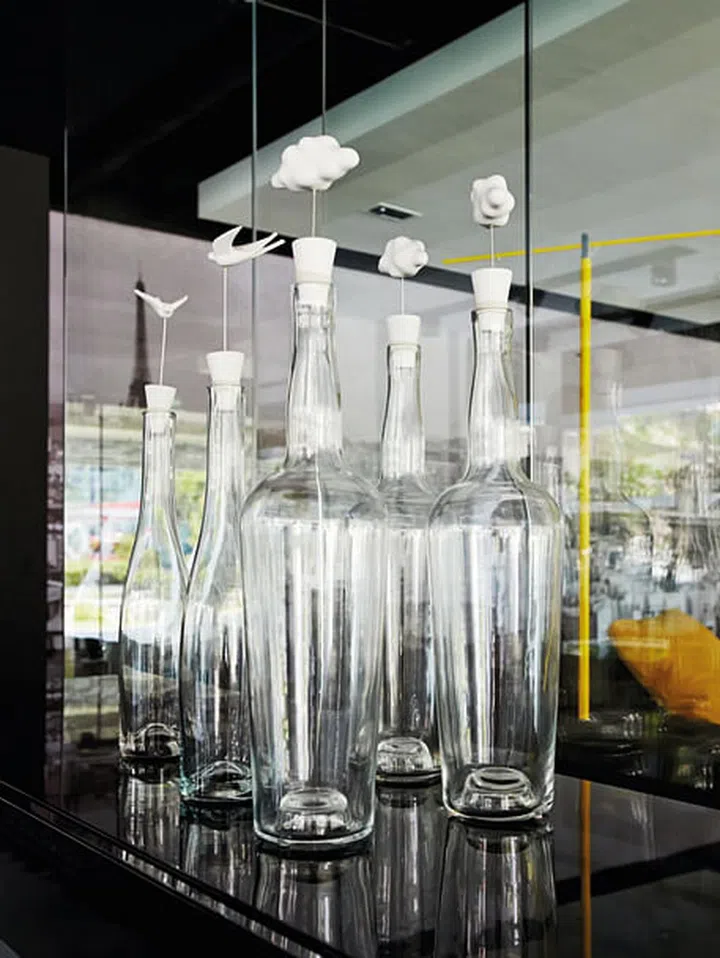 These pretty glass bottles are also functional as table lamps, displayed in the Roche Bobois Singapore showroom (2014).