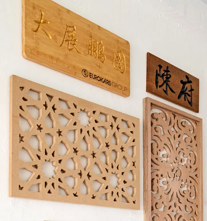 Kai uses a mix of lasercut technology and traditional handcrafting techniques to create his modern signs.