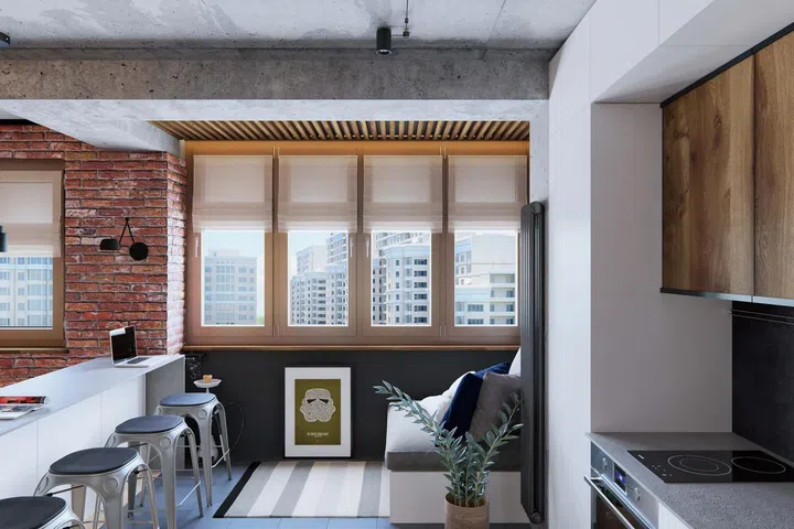 A concrete screed ceiling and red brick walls, and glass partitions that help create a brighter and airier ambience.