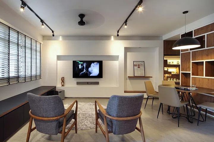 With only a small space to work with, this homeowner did away with a large sofa and instead replaced it with a built-in seat along the window. This gave the owner more space for a larger dining table. By using a round dining able, the family can now focus on dinner with each other, instead of lounging around the television.