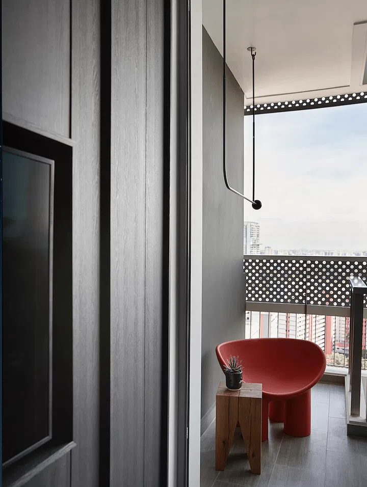 Pictured: The balcony serves as a dining-cum-work space. Even the clothes hanger resembles an art installation.