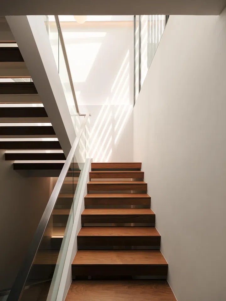 Sunlight floods the stairwell.