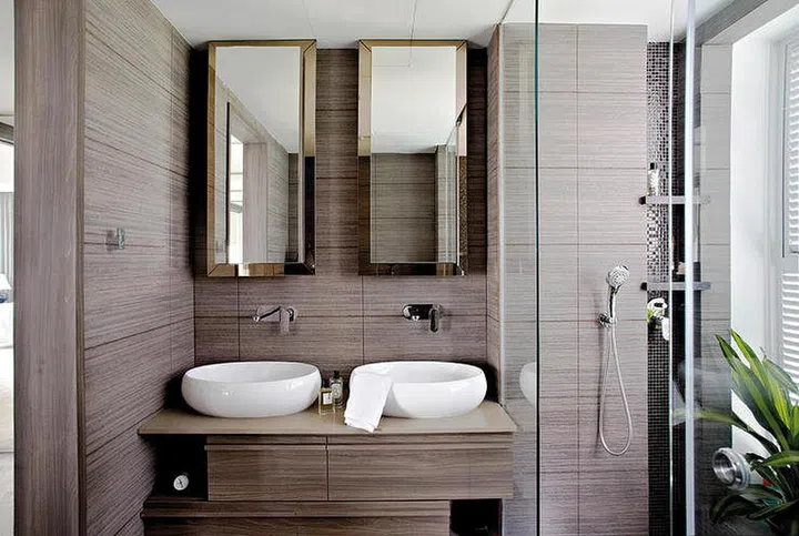 If you live in a larger HDB flat with spacious bathrooms, consider having two sinks. Interior design by Project File.