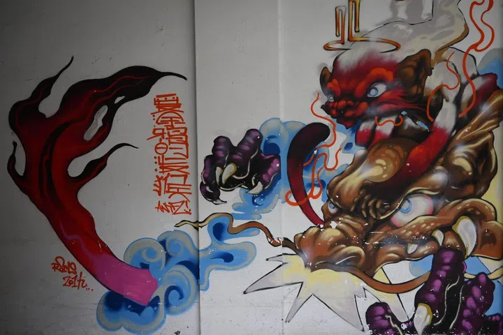 Graffiti found on white walls of Pearl's Hill Terrace.