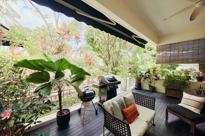 Surrounded by mature greenery, the ground-floor terrace serves as a semi-outdoor social space where the family  relaxes, entertains and enjoys the estate’s peaceful setting.