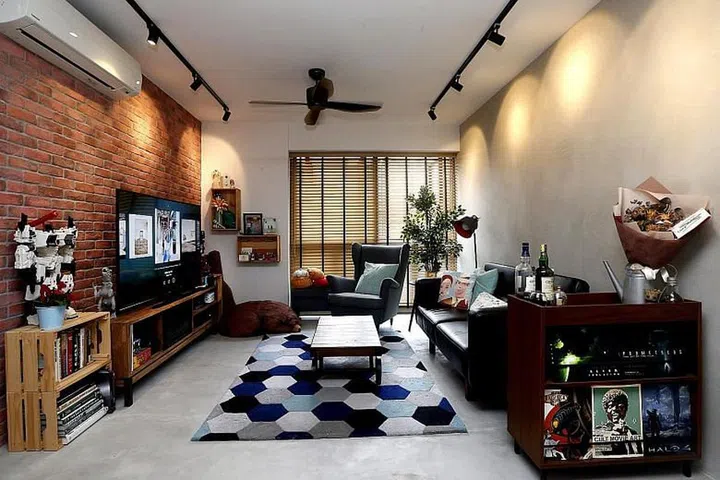 pcycled wine crates are used as shelves in the living room, especially for the toy collections of home owners Marcus Wong and Gayle Tan. ST PHOTO: CHEW SENG KIM