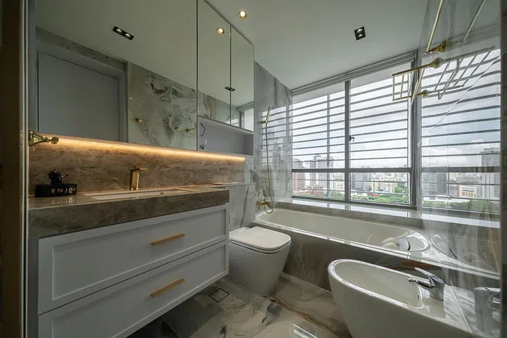 The space is adorned with marble-like tiled floors and walls, creating a luxurious and visually striking environment that seamlessly integrates the opulence of rococo aesthetics with contemporary sensibilities.