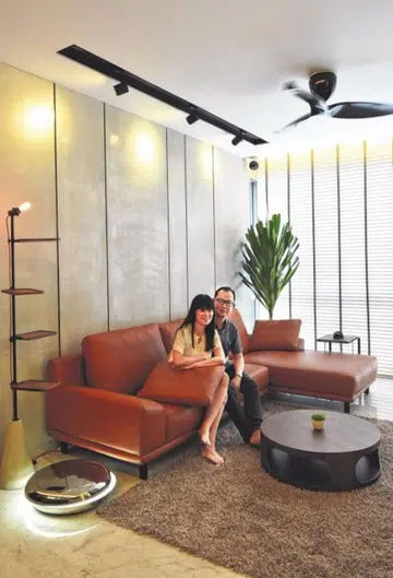 Married couple Dave Siah who is in retail sales, and Wendy Koh, a housewife posing in their 3-Bedroom Condominium in Balestier.