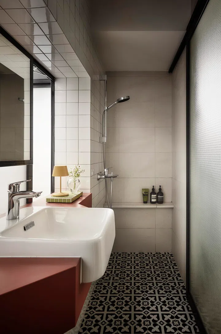 The bathroom balances modern fittings with subtle heritage references, creating a space that feels both comforting and characterful.