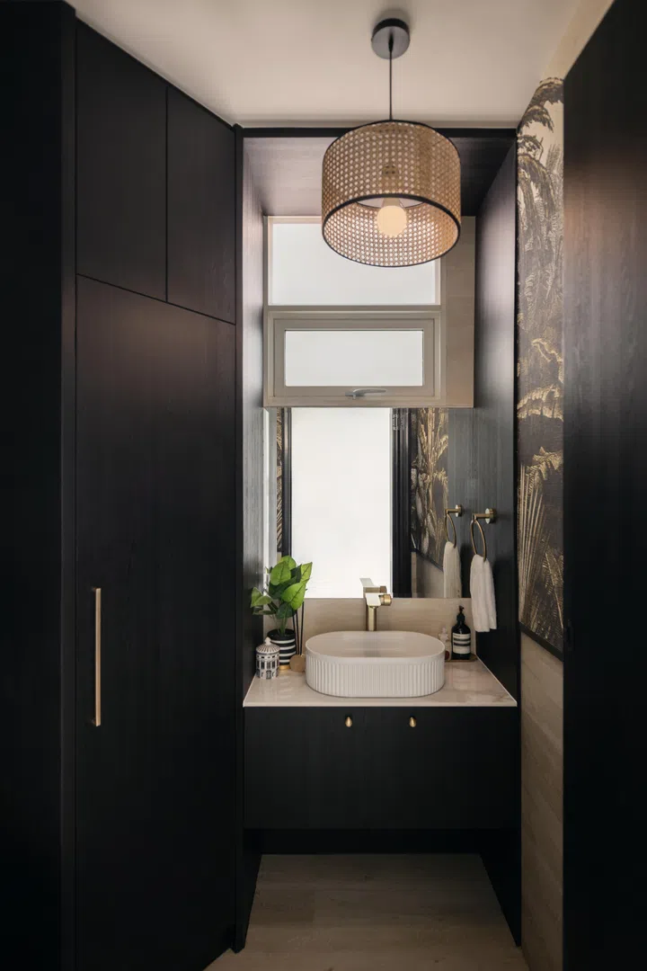 The original common bathroom in the house was converted into a powder room.