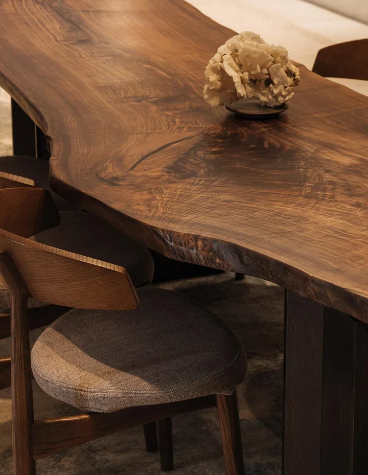 A 13-metre long bespoke rug runs under the dining table in this 6,534 sq ft semi-detached at Jalan Belibas, Upper Thomson designed by Metre Architects.