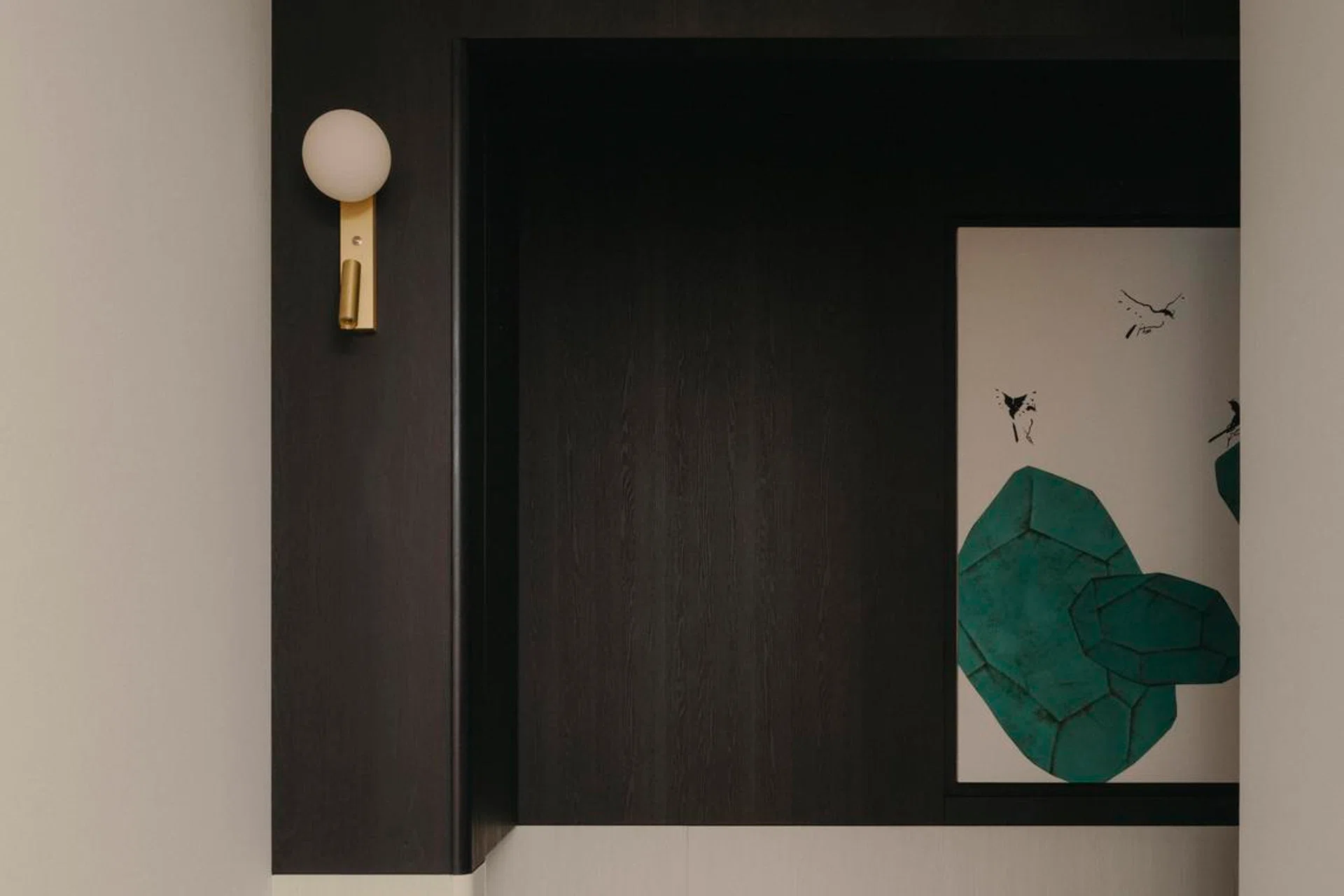 A dark timber-lined ceiling gently lowers over the entry corridor, guiding the eye forward before opening out into the living and dining area of a 3-bedroom (1,098 sq ft) condo in Penrose.