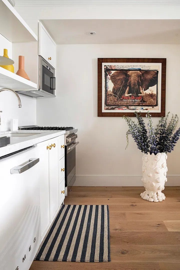 The open kitchen offers convenience and becomes a source of interest to the decor of the dining area.