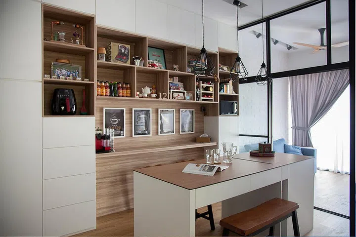 A small, cushioned tan leather dining bench stool at a white and wood dining table. Interior design by EightyTwo.