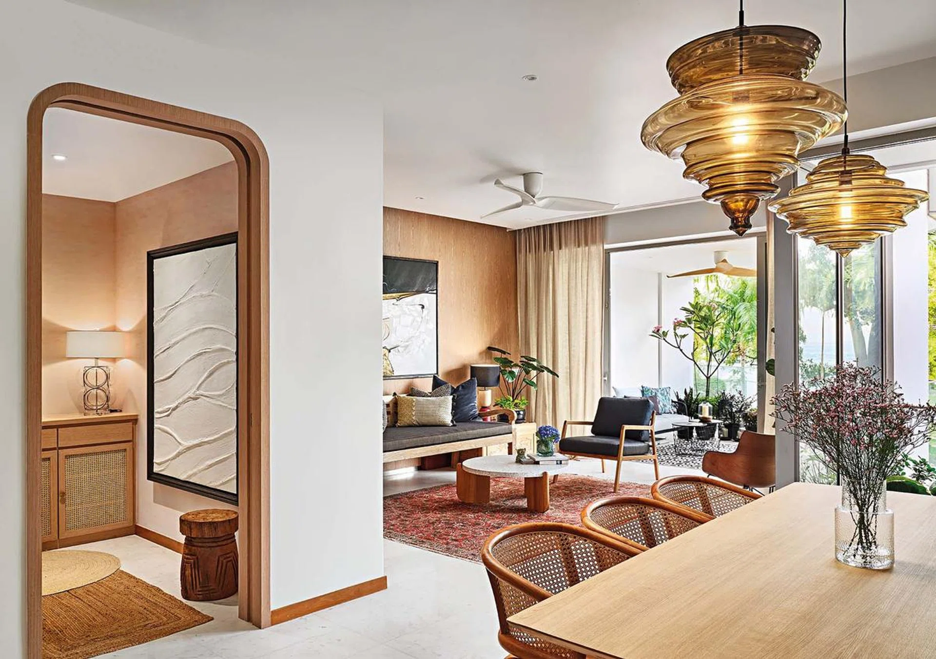 The home’s warm colour scheme, layered with a wealth of textures, evokes an effortless seaside tropical vibe.