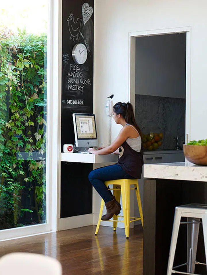 Make use of existing dining chairs with this wall ledge that has just enough space for your computer and a cup of coffee.