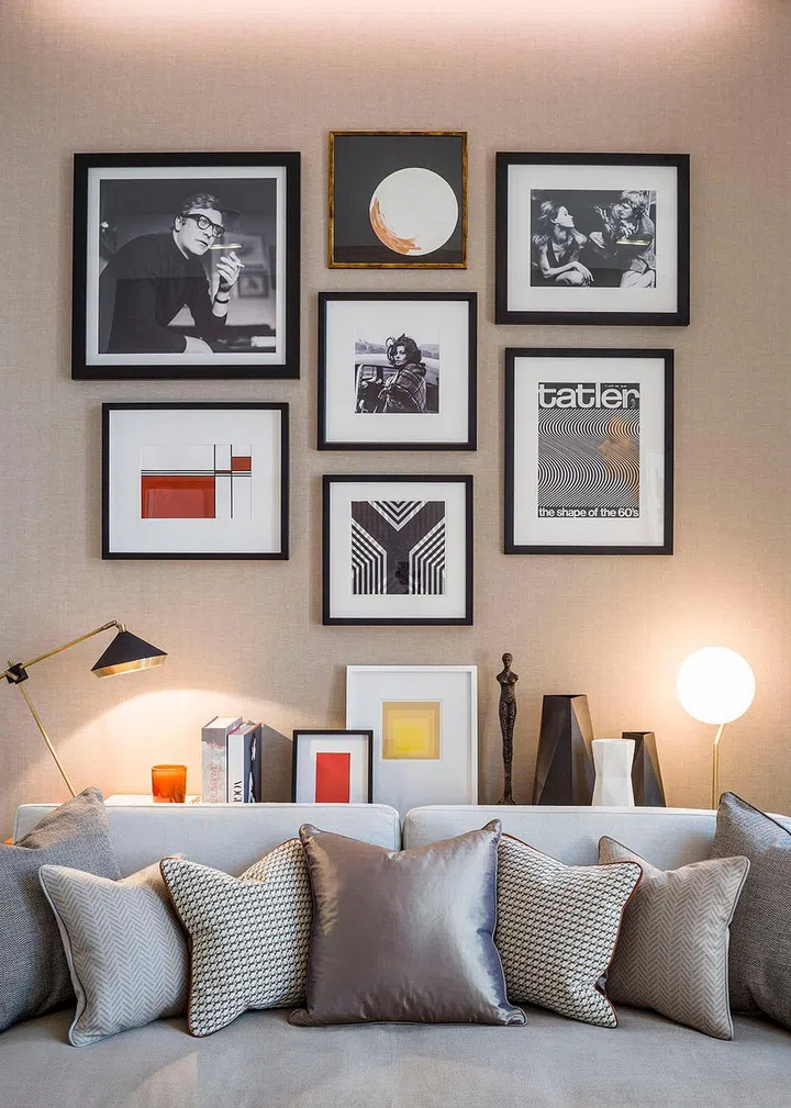 Framed images on the study's wall are pictorial reference to the building's history, which used to be home to publishing group IPC Media.