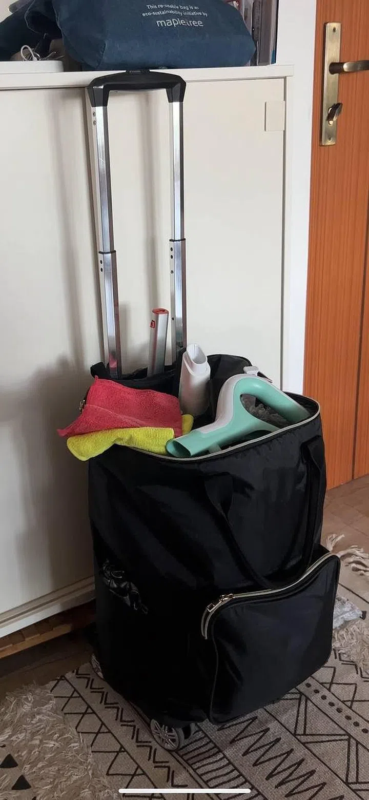 urban company cleaning tools in a suitcase