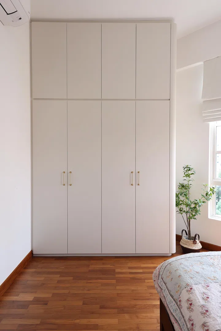 Custom shelving provides practical storage while keeping to the home’s minimalist, wood-toned aesthetic.