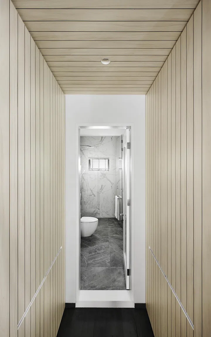 Entrance to the master bathroom after renovation in a 3-bedroom condo in East Coast.