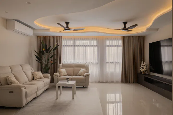 A sweeping curved ceiling softens the long, boxy living room, while a reinforced feature wall anchors the couple’s 100-inch television.