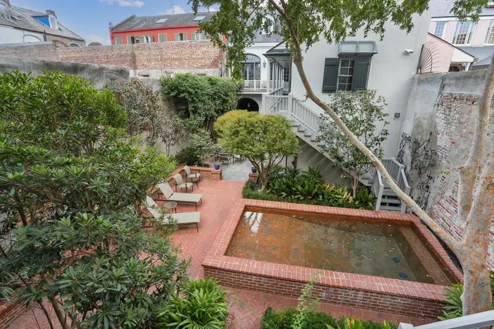 The peaceful inner courtyard sports a pool and fountain.