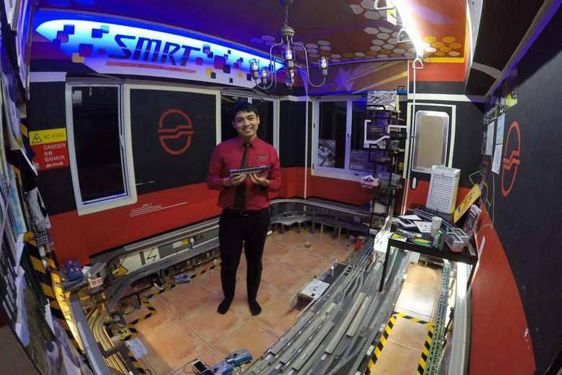 Pictured here is a then 19-year-old Isaac Nathaniel D’Souza, who spends his working hours at Jurong East MRT station.