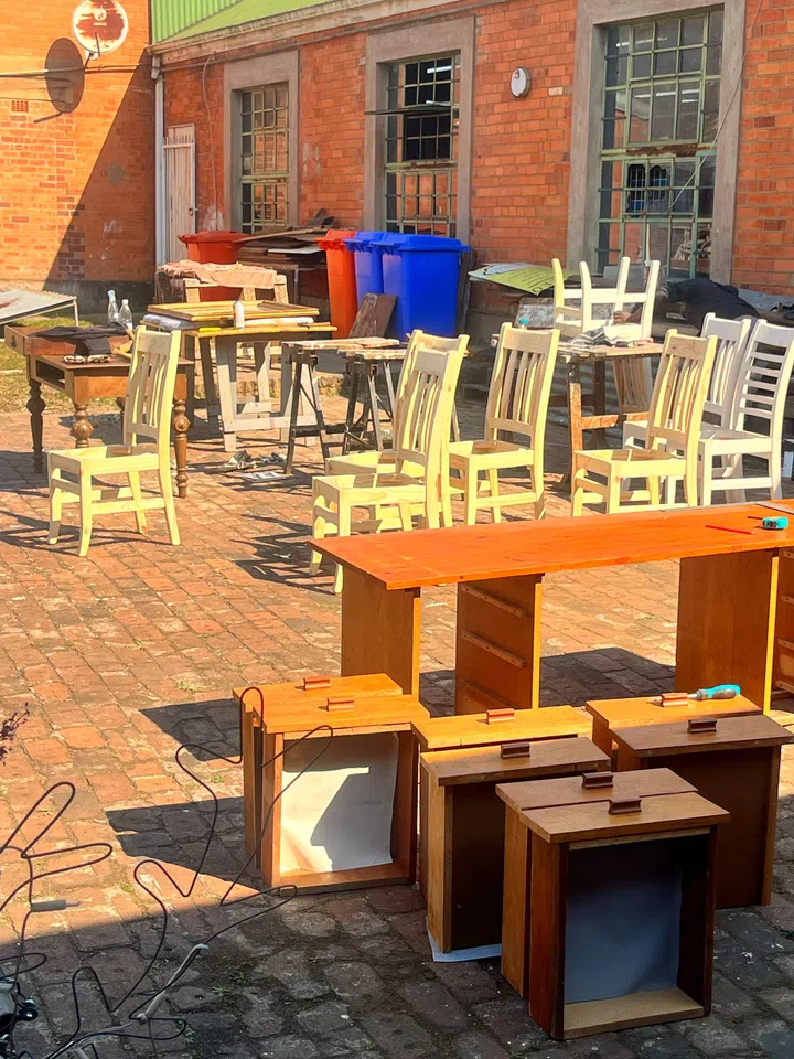 The outside of Amy and Lawrence’s workspace, where they work on restoring old furniture along with their team.