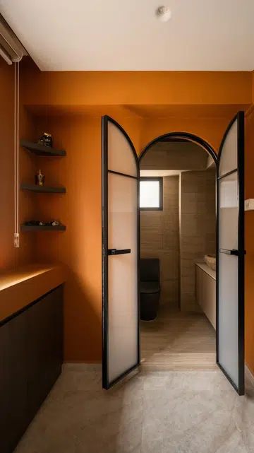 An arched fluted-glass doorway marks the transition from the prayer space into the ensuite bathroom.