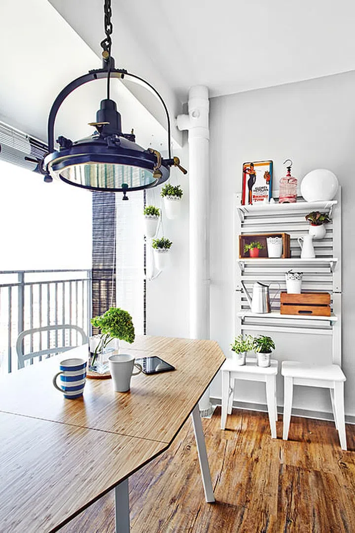 The designer took advantage of the wide, breezy balcony to move the dining spot here. A water-resistant PVC laminate clads the floor.